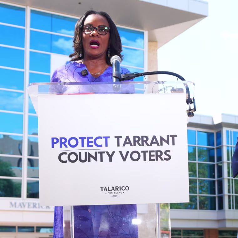 Democratic Senate candidate James Talarico, right, looks on as Tarrant County Commissioner Alisa Simmons speaks during a news conference at UTA.