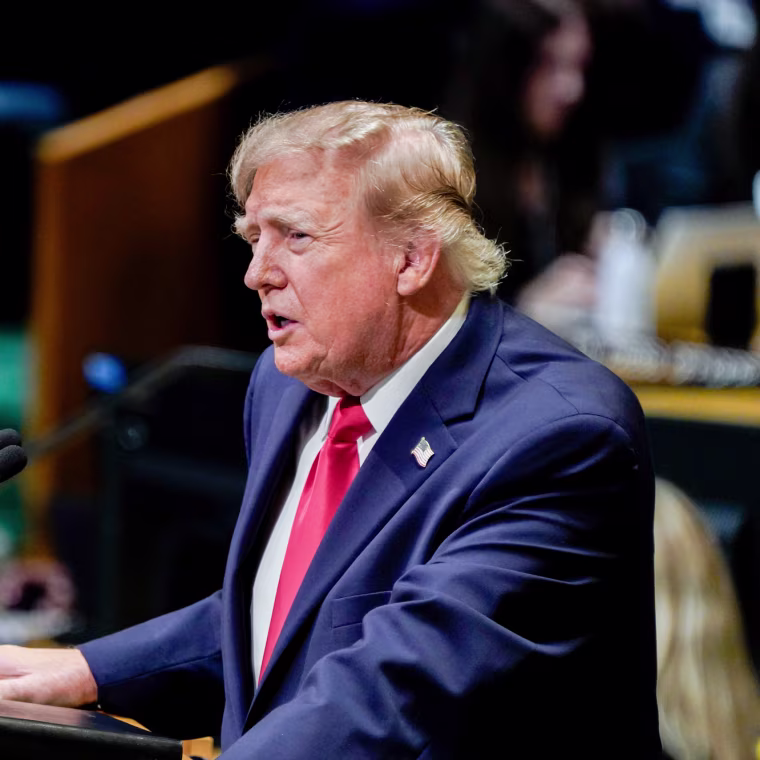 Donald Trump speaks at a podium