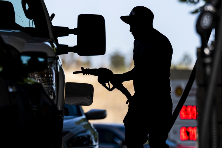 Image: A customer fills up their gas tank at a gas station on June 22, 2022 in Hercules, Calif.
