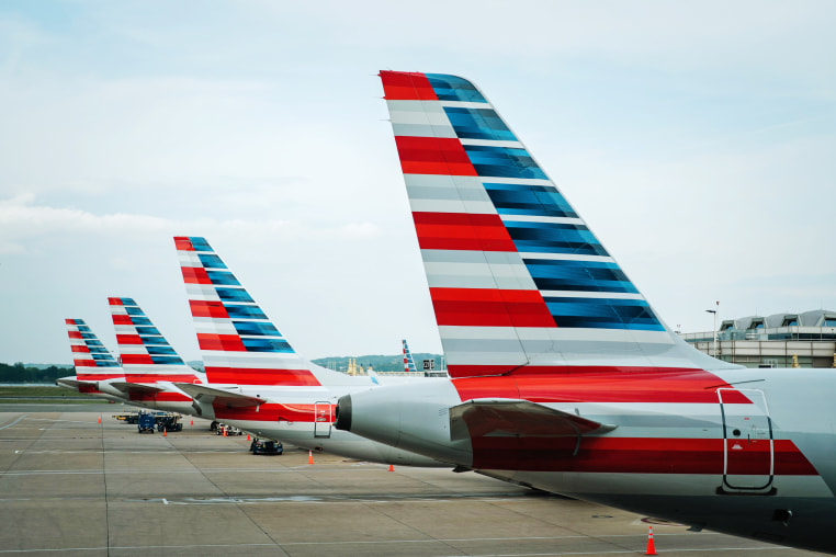 Tails of American Airline planes are seen as the planes sit parked at gates at Reagan National Airport on Thursday, April 27, 2023 in Arlington, Va.