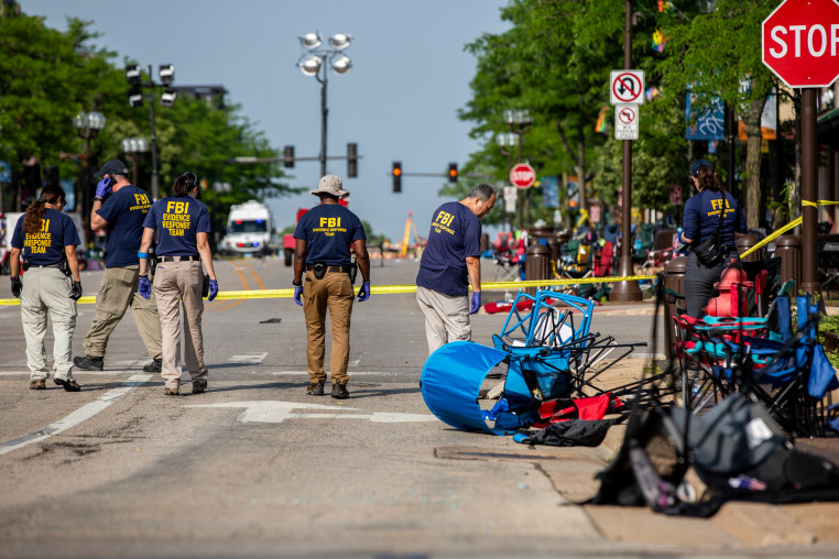 FBI agents work the scene of a shooting at a Fourth of July parade in Highland Park, Ill. on July 5, 2022. 