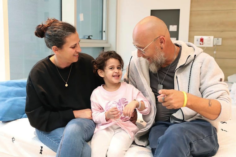 Abigail Edan, who returned to Israel after being released by Hamas, with her aunt Liron and uncle Zuli at Schneider Children's Medical Center in Israel. Abigail's parents were both killed by Hamas militants in the same attack in which she was kidnapped.