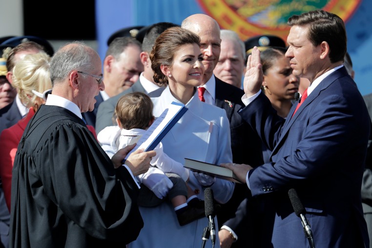Ron DeSantis, right, is sworn in as Florida Governor by Chief Justice Charles Canady, in Tallahassee, Fla., on  Jan. 8, 2019.