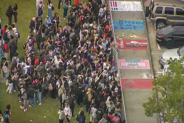 Students at at Monarch High School in Coconut Creek walked out of class around noon Tuesday to protest the reassignment of Principal James Cecil and staffers.