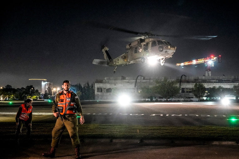 Image: An Israeli Air Force helicopter carrying an Israeli hostage released by Hamas lands at the Sheba Medical Center in Ramat Gan, Israel