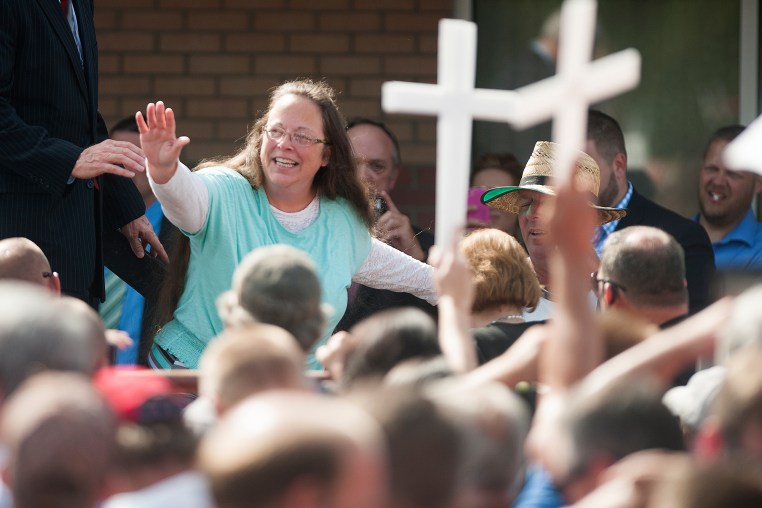 Rowan County Clerk of Courts Kim Davis waves to a crowd of her supporters at a rally in front of the Carter County Detention Center on Sept. 8, 2015 in Grayson, Ky.
