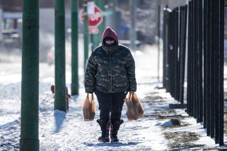 Image: A lone person walk almost a half mile to their home in Chicago