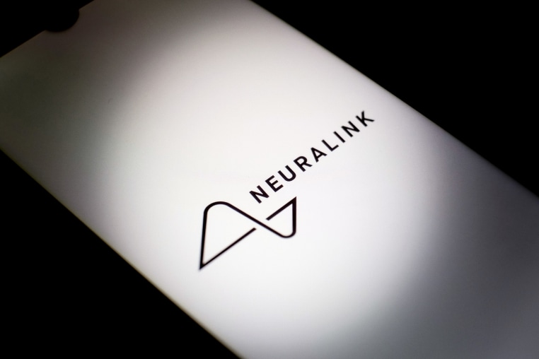 The Neuralink logo on a smartphone screen.