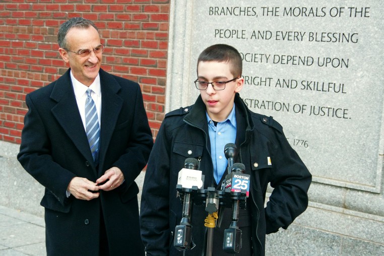 Middle schooler Liam Morrison speaks outside of the U.S. Court of Appeals for the First Circuit in Boston on Thursday morning, Feb. 8, 2024. His attorney, David Cortman, looks on.