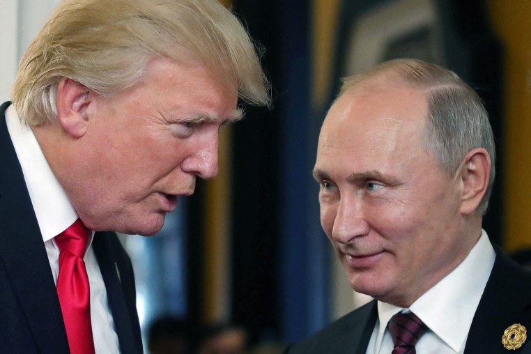 Donald Trump, left, chats with Vladimir Putin