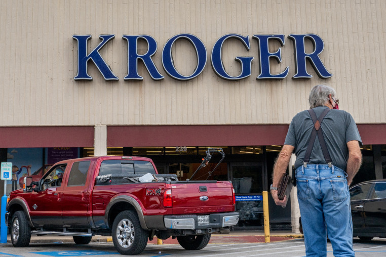 A customer walks into a Kroger grocery store in Houston