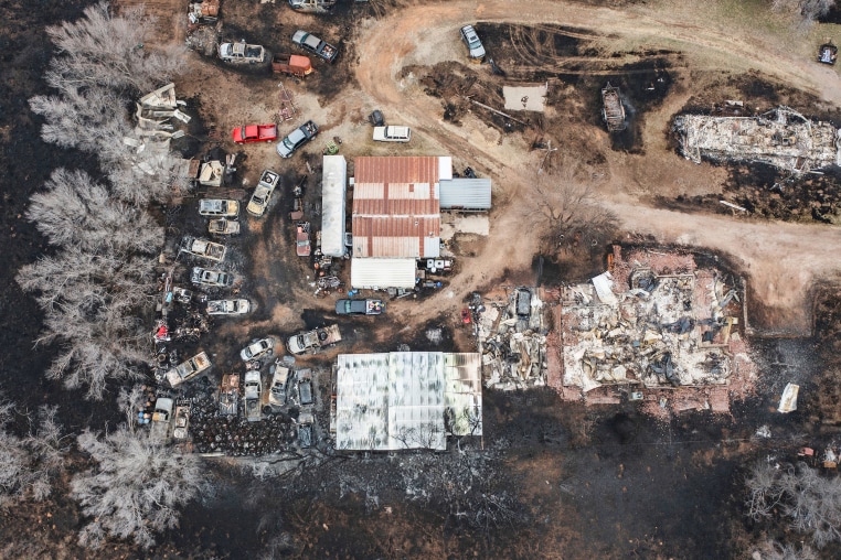 Aerial of destroyed homes and cars.