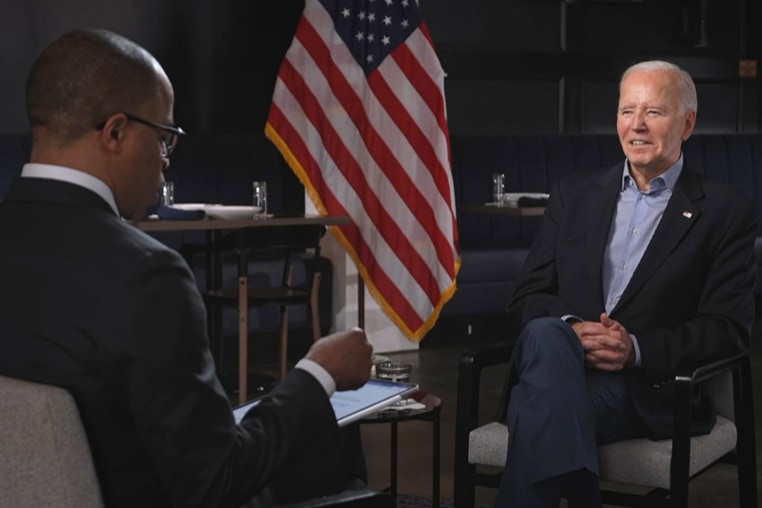 Jonathan Capehart, left, with President Joe Biden.