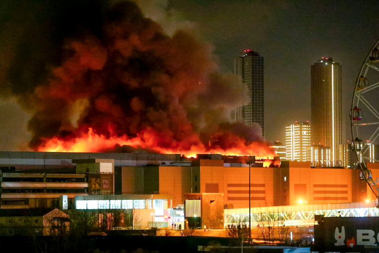 Smoke rises above the Crocus City Hall concert venue near Moscow after a reported shooting.