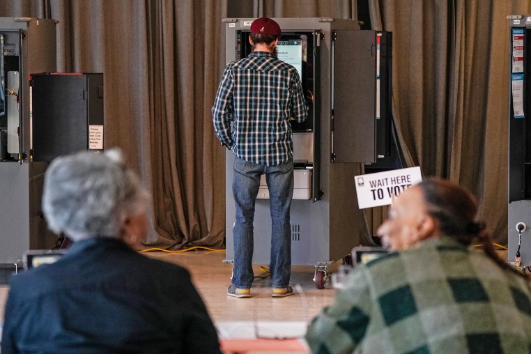 Voters cast their ballots during the Georgia presidential primary elections in Atlanta on March 12, 2024.