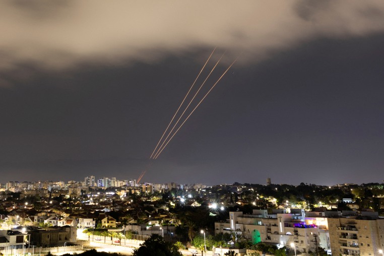 An anti-missile system operates after Iran launched drones and missiles towards Israel, as seen from Ashkelon