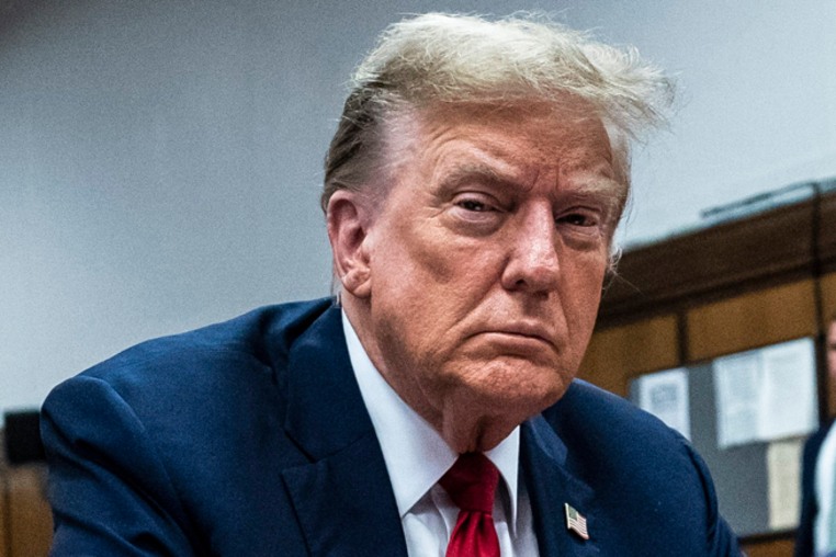 Former President Donald Trump appears with his legal team, Todd Blanche and Emil Bove, right, ahead of the start of jury selection at Manhattan Criminal Court on April 15, 2024 in New York City.