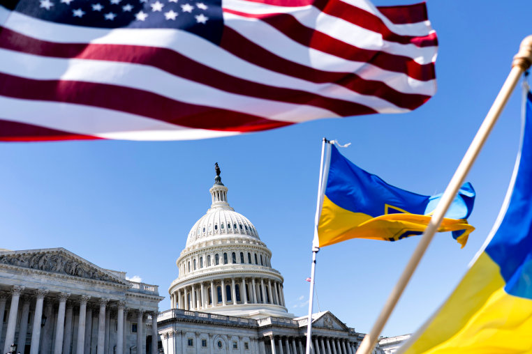 American and Ukrainian flags fly.