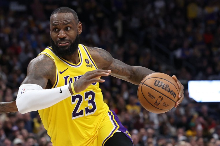 LeBron James of the Los Angeles Lakers drives against Kentavious Caldwell-Pope of the Denver Nuggets in the fourth quarter during game two of the Western Conference First Round Playoffs at Ball Arena on April 22, 2024 in Denver.