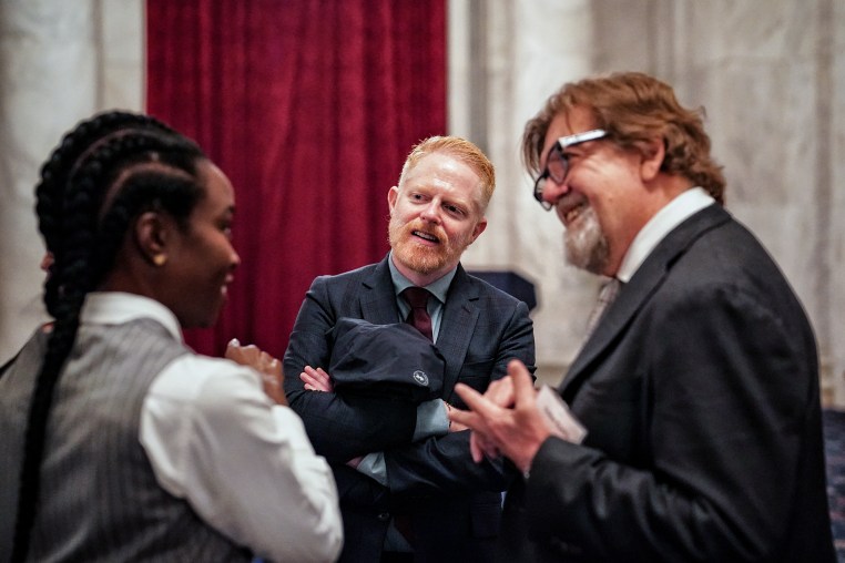 Actors Jesse Tyler Ferguson and Danai Gurira talk to Oskar Eustis in the Russell Senate Office Building while advocating for the Save Our Stages Act on April 11, 2024.