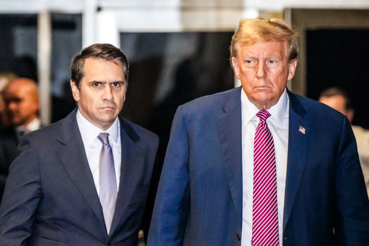 Todd Blanche and Donald Trump speak to the media