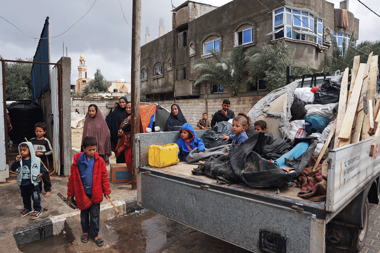 Displaced Palestinians flee the southern city of Rafah after Israel ordered evacuations. 
