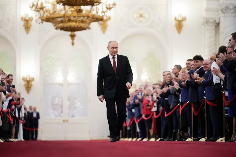 Vladimir Putin walks by a crowd before his inauguration ceremony at the Kremlin in Moscow.