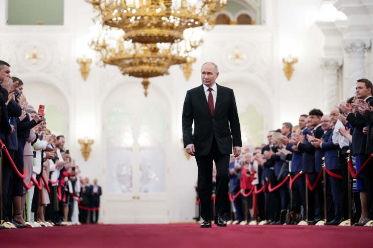 Vladimir Putin walks to take his oath as Russian president during an inauguration ceremony in the Grand Kremlin Palace in Moscow.