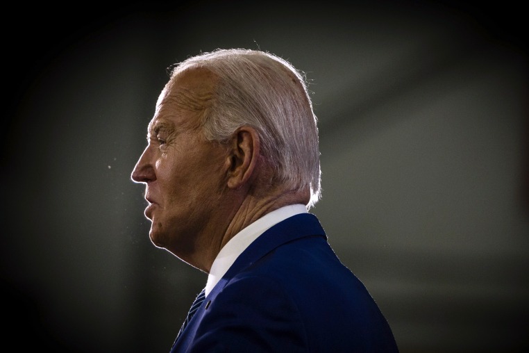 President Joe Biden against a dark background.