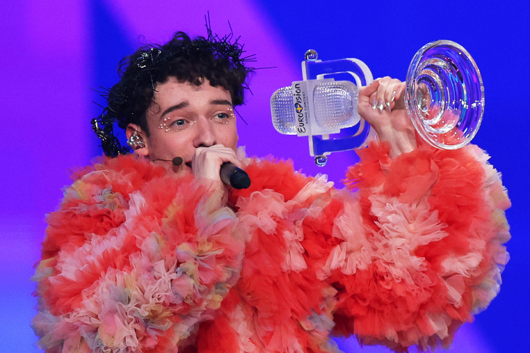 Nemo from Switzerland celebrates with the trophy for winning Eurovision