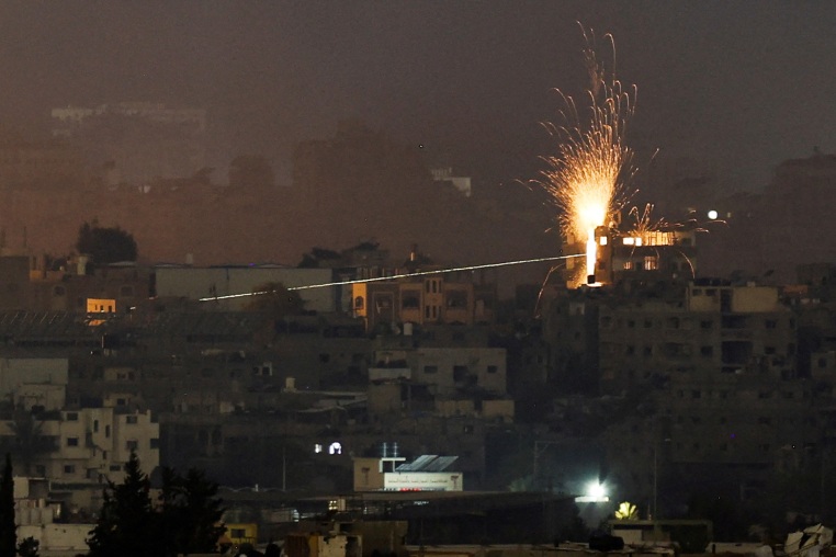 A missile hits a building in northern Gaza