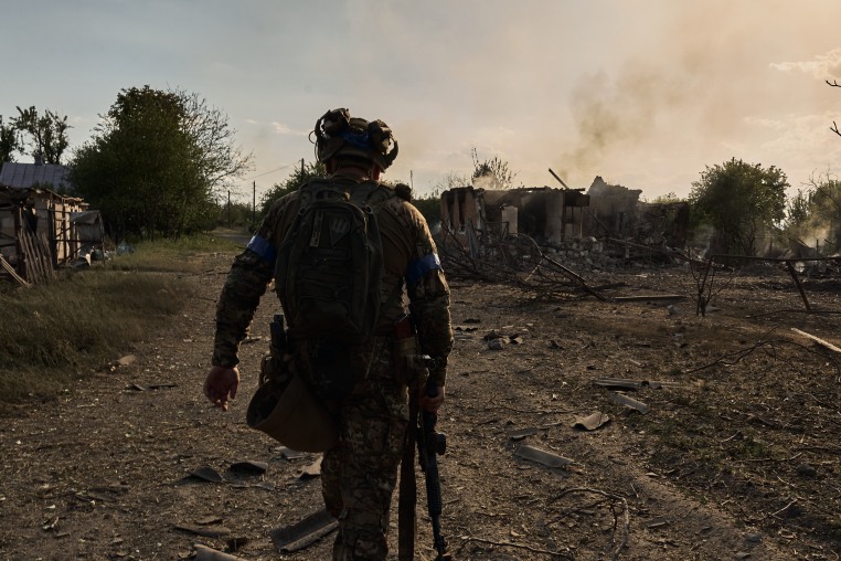 Ukrainian soldiers defend the frontline, which passes through the Ukrainian boarder city of Vovchansk, in Chuhuiv Raion, Kharkiv Oblast