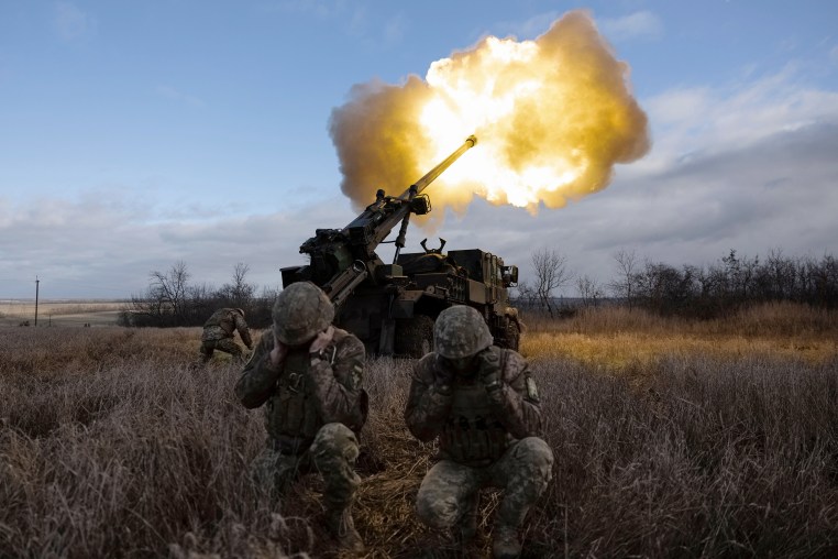 Ukrainian servicemen fire with a self-propelled howitzer towards Russian positions in eastern Ukraine on December 28, 2022. 