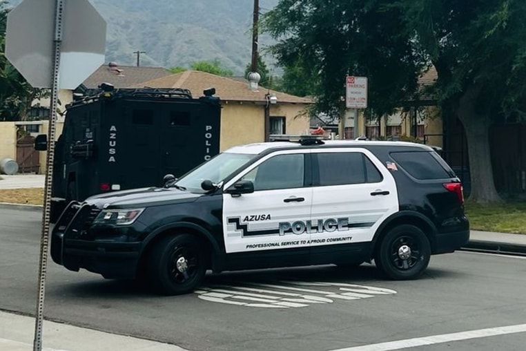 Azusa, California, police vehicles outside a home. 