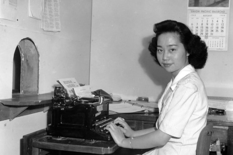Mitsuye Endo, Supreme Court figure, seated at her desk in the administrative office at the Central Utah Relocation Center, 1942.