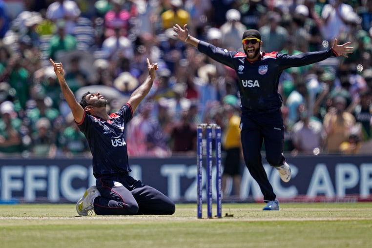 United States' Saurabh Nethralvakar, left, celebrates after their win in the ICC Men's T20 World Cup cricket
