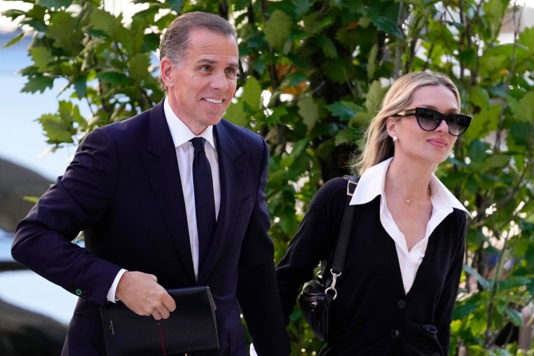 Hunter Biden and his wife smile as they arrive to court