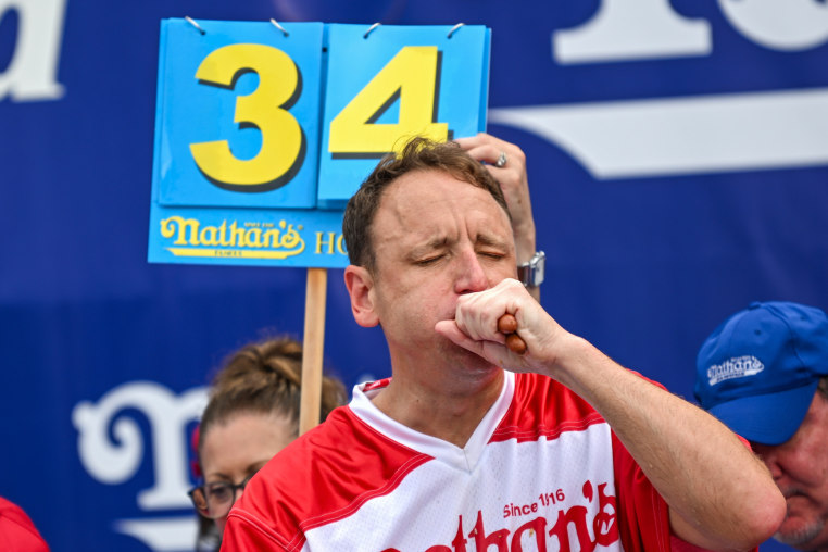 Defending champion Joey Chestnut competes in the Nathan's Famous hot dog eating contest on July 4, 2023, at Coney Island in Brooklyn.