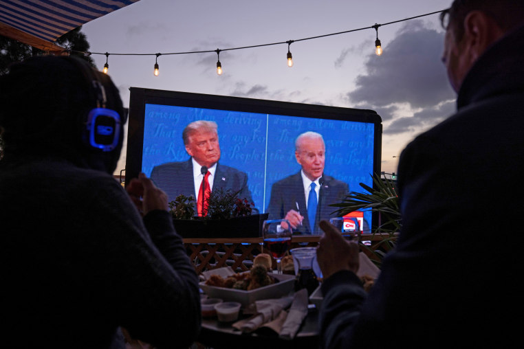 Diners at a tavern in San Diego watch Donald Trump and Joe Biden in a presidential debate on Oct. 22, 2020. 