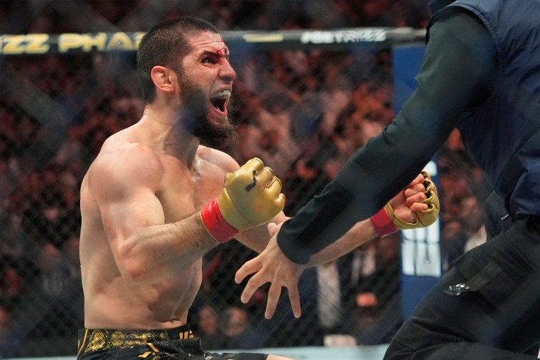 Islam Makhachev celebrates after defeating Dustin Poirier in a lightweight title bout at the UFC 302 mixed martial arts event on Sunday in Newark, N.J. 