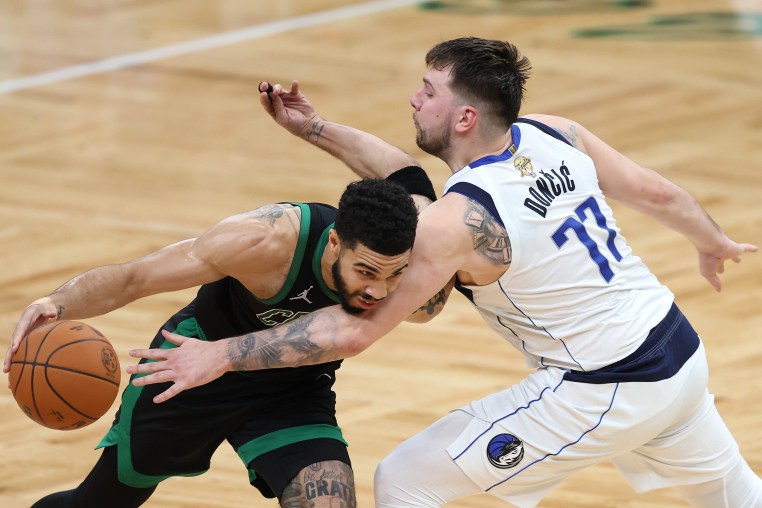 Jayson Tatum #0 of the Boston Celtics drives to the basket against Luka Doncic #77 of the Dallas Mavericks during the second quarter in Game Two of the 2024 NBA Finals at TD Garden on Sunday in Boston, Massachusetts. 