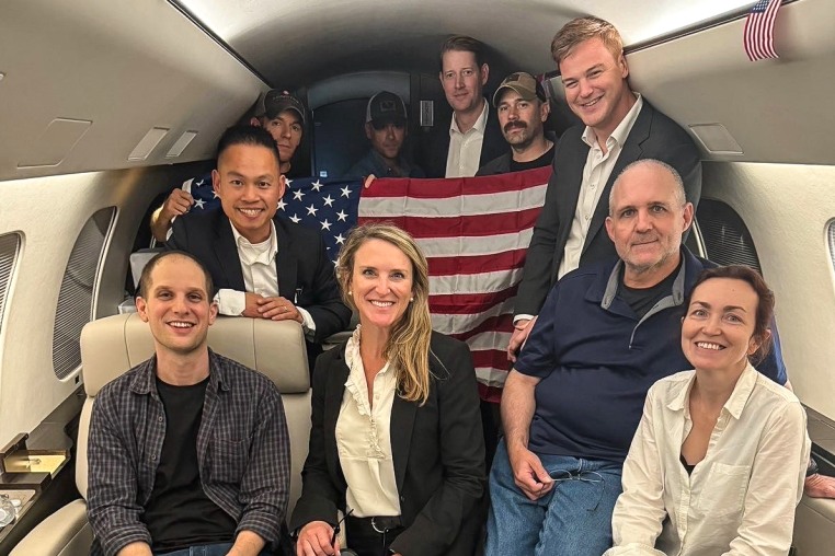 A photo of the Americans detained in Russia on an airplane headed towards the United States, posted to the POTUS X account.