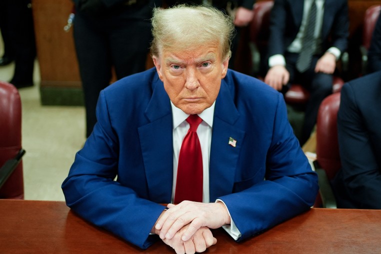 Donald Trump looks on in the courtroom