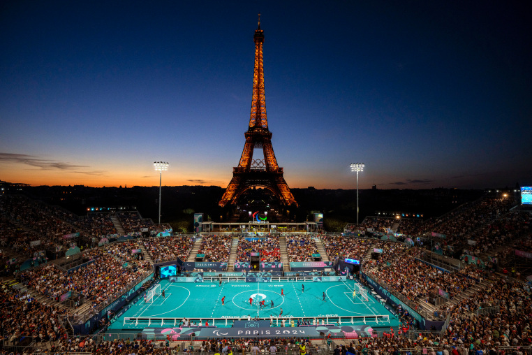 Blind soccer players from France and China compete in a Preliminary Round Group at the Eiffel Tower Stadium during the 2024 Paralympics on Sunday, Sept. 1, 2024.