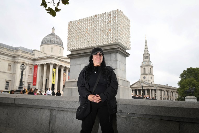 Mexican artist Teresa Margolles poses with her work of art, "A Thousand Times in an Instant."