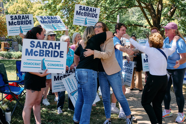 Sarah McBride hugs a supporter.