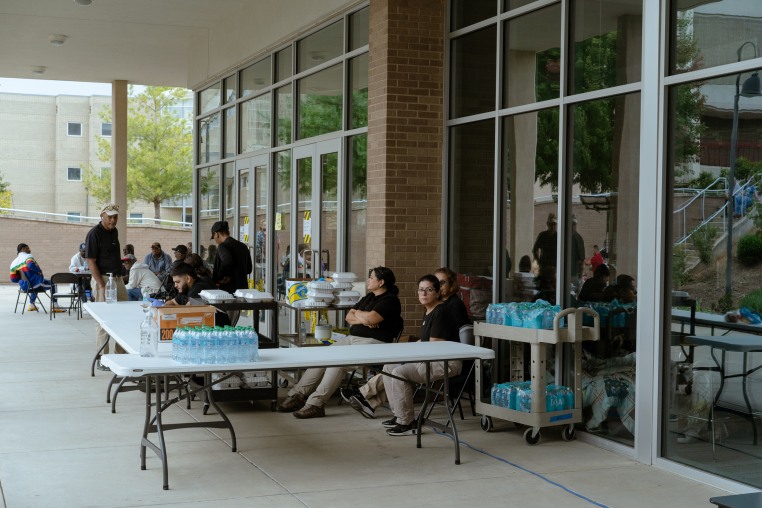 Volunteers waiting to hand out food at the Red Cross shelter on the Asheville-Buncombe Technical Community College in Asheville, NC on Monday, Sept. 30, 2024.