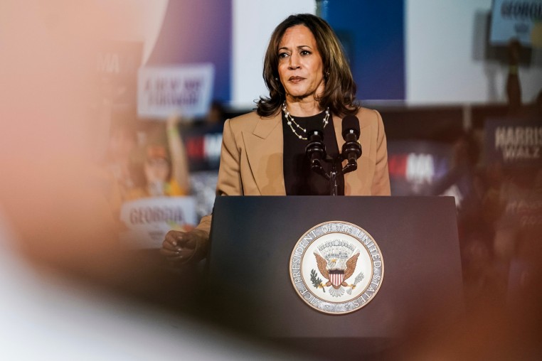 Kamala Harris stands at a podium