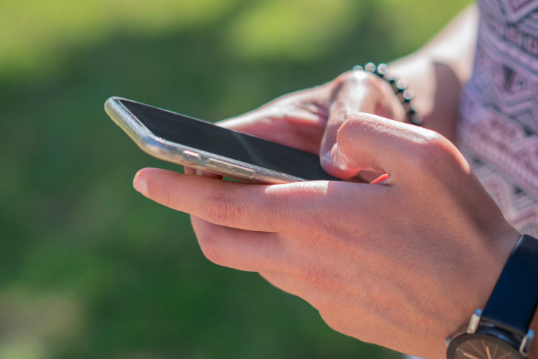 A person using their smartphone