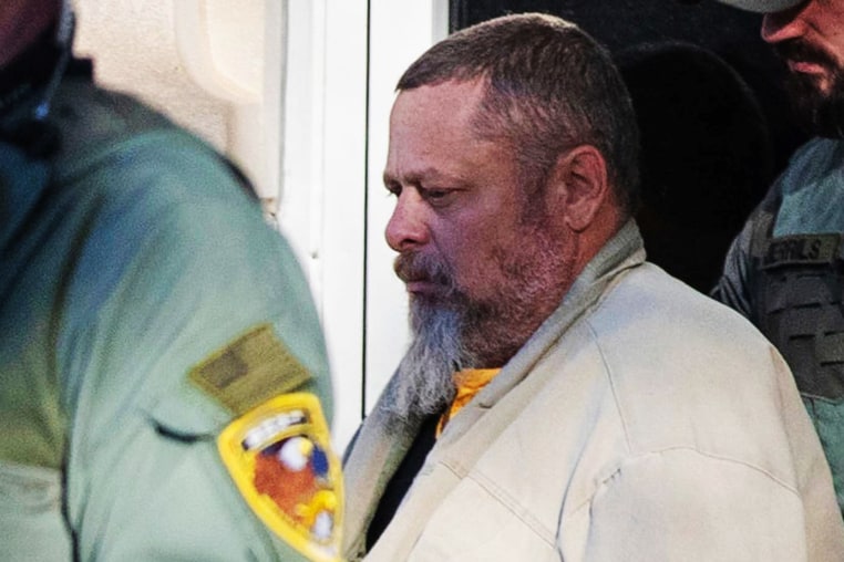 Officers transport murder suspect Richard Allen on Nov. 22, 2022, at Carroll County Courthouse in Delphi, Ind.